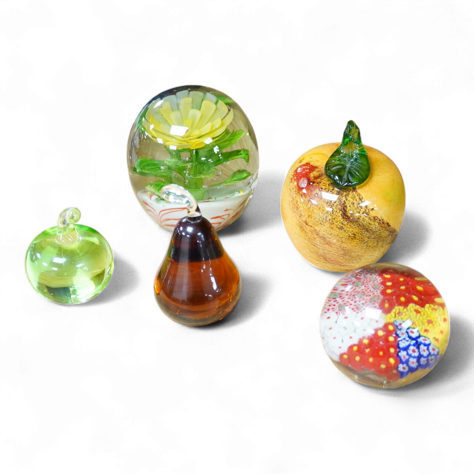 A Collection of five various glass paperweights, largest 11cm